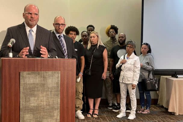 PHOTO: Attorney Rex Elliott addresses reporters with the extended family of Donovan Lewis behind him, on Sept. 1, 2022, in Columbus. Ohio.  (Andrew Welsh-Huggins/AP)