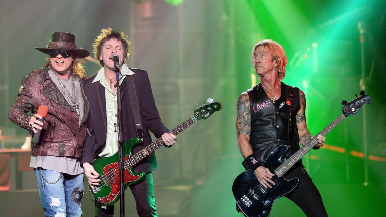  Singer Axl Rose (L) and bassist Tommy Stinson of Guns N' Roses perform at The Joint inside the Hard Rock Hotel & Casino during the opening night of the band's second residency, "Guns N' Roses - An Evening of Destruction. No Trickery!" on May 21, 2014 in Las Vegas, Nevada. 