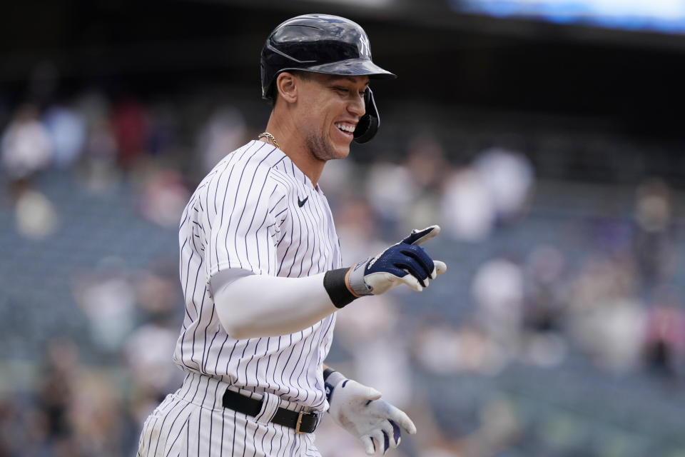 New York Yankees designated hitter Aaron Judge reacts after drawing a bases-loaded walk for the winning run against the Chicago White Sox in a baseball game, Sunday, May 23, 2021, at Yankee Stadium in New York. Clint Frazier scored on the play. (AP Photo/Kathy Willens)