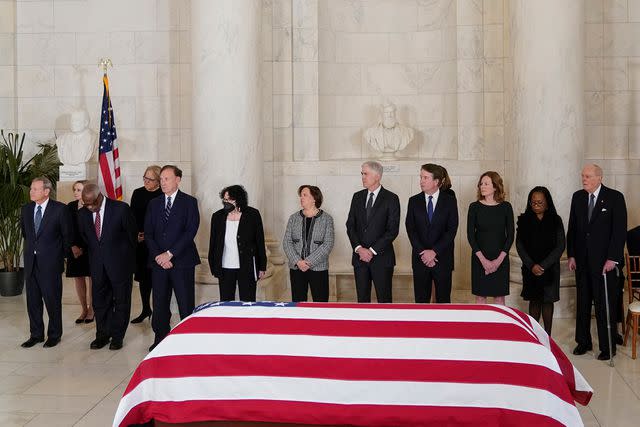 <p>AP Photo/Jacquelyn Martin</p> From left, Chief Justice of the United States John Roberts, Justice Clarence Thomas, Justice Samuel Alito, Justice Sonia Sotomayor Justice Elena Kagan, Justice Neil Gorsuch, Justice Brett Kavanaugh, Justice Amy Coney Barrett, Justice Ketanji Brown Jackson and retired Justice Anthony Kennedy, stand in front flag-draped casket of retired Supreme Court Justice Sandra Day O'Connor during a private service in the Great Hall at the Supreme Court in Washington, Monday, Dec. 18, 2023.