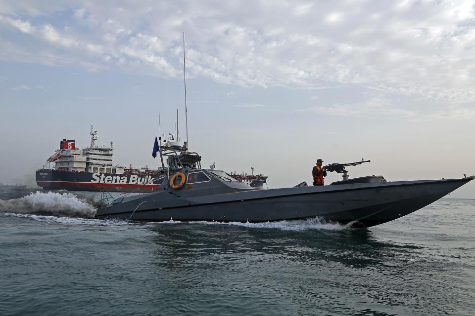 A picture taken on July 21, 2019, shows Iranian Revolutionary Guards patrolling around the British-flagged tanker Stena Impero as it's anchored off the Iranian port city of Bandar Abbas. - Iran warned Sunday that the fate of a UK-flagged tanker it seized in the Gulf depends on an investigation, as Britain said it was considering options in response to the standoff. Authorities impounded the Stena Impero with 23 crew members aboard off the port of Bandar Abbas after the Islamic Revolutionary Guard Corps seized it Friday in the highly sensitive Strait of Hormuz. (Photo by Hasan Shirvani / MIZAN NEWS AGENCY / AFP)        (Photo credit should read HASAN SHIRVANI/AFP/Getty Images)