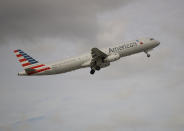 In this Thursday, Nov. 29, 2018, photo, an American Airlines Airbus A321 takes off from Fort Lauderdale–Hollywood International Airport in Fort Lauderdale, Fla. On Friday, June 14, 2019, a federal judge ordered unions that represent American Airlines mechanics not to interfere in the airline's operations. (AP Photo/Wilfredo Lee)