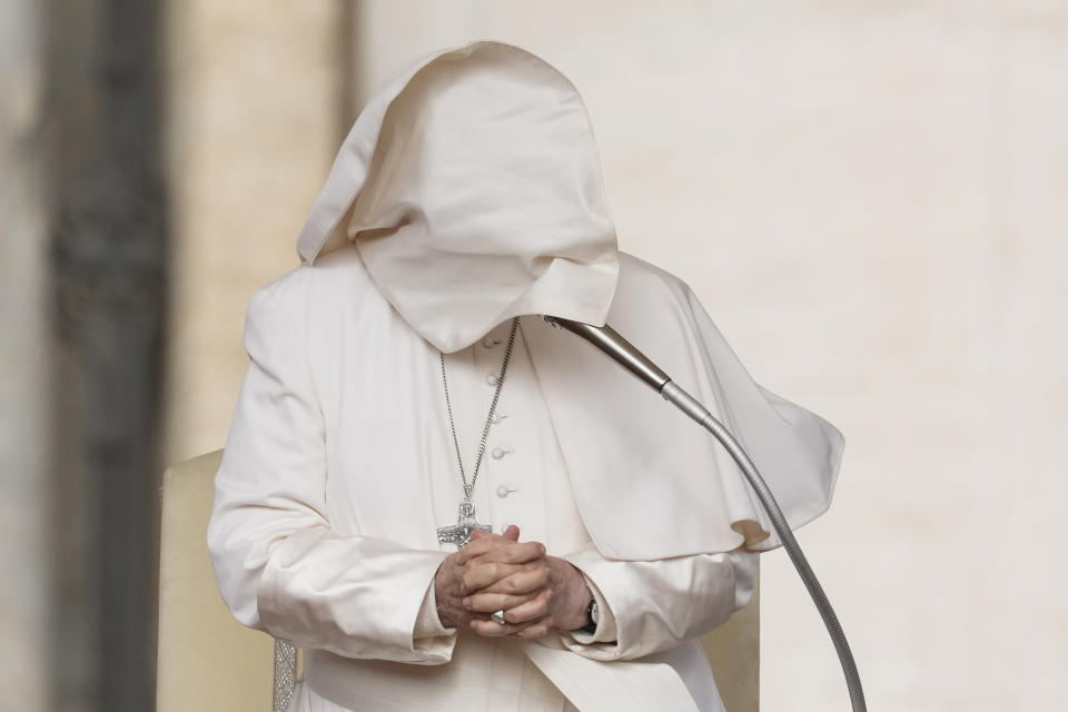 A gust of wind blows Pope Francis's mantle as he stands during his weekly general audience in St. Peter's Square at The Vatican, Wednesday, April 10, 2024. (AP Photo/Andrew Medichini)