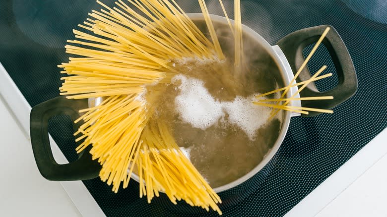 Spaghetti cooking in a pot