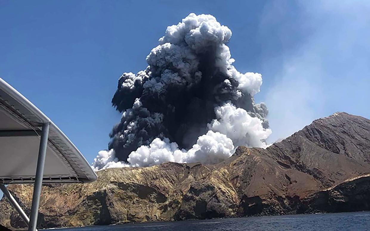 This handout photo taken on December 9, 2019 and provided courtesy of Lillani Hopkins through her Facebook account on December 12 shows a plume of ash rising into the air as the volcano on White Island erupts off the coast of Whakatane on New Zealand's North Island - AFP