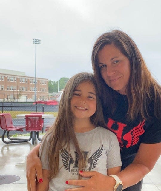 Durfee assistant athletic director  Kristen Gauvin poses with her daughter Claire outside at B.M.C. Durfee High school.