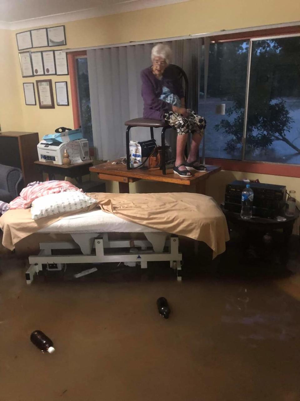 Val, 92, and her son were rescued shortly after this photos was taken. Source: Supplied