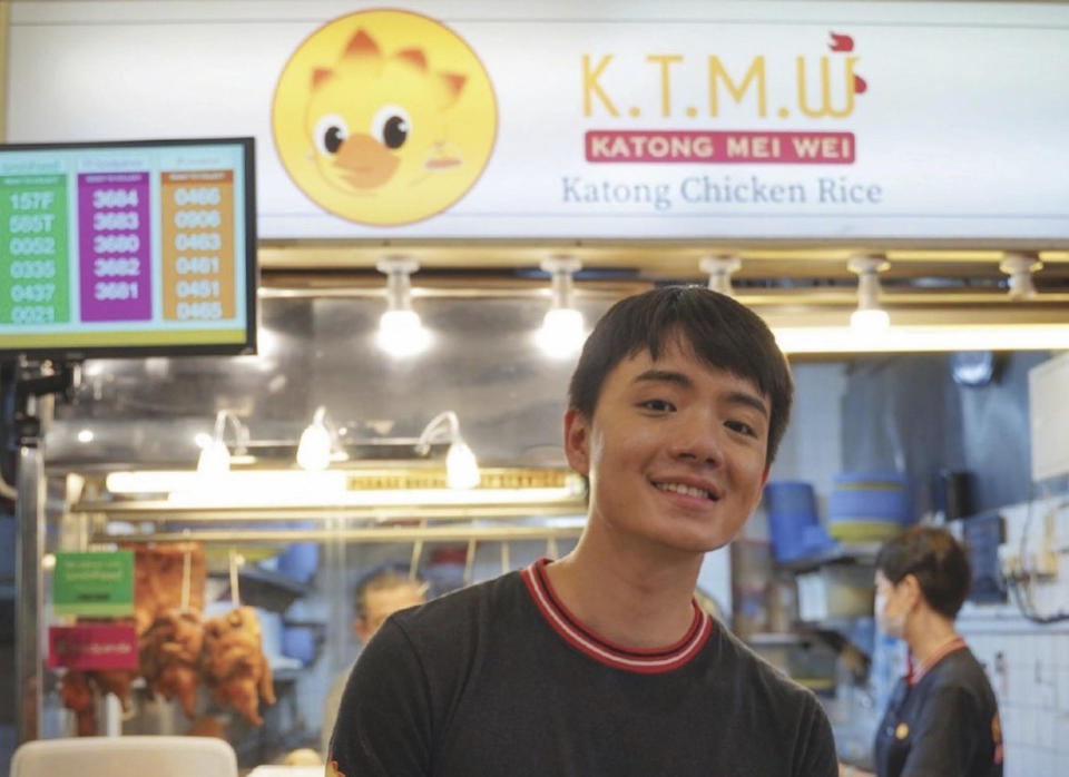 Soki Wu, owner of Wu's Katong Mei Wei Boneless Chicken Rice stall stand infant of his stall in a food court at a shopping mall in Singapore, Malaysia, Friday, July 8, 2022. Soki Wu's food stall, tucked in a food court in a shopping mall in Singapore, is a crowd favorite for its fresh, juicy “chicken rice”, the country's national dish. Customers recently began complaining that the chicken he was serving didn't quite taste the same_ and wasn't as good. That's because Wu had changed to using frozen chickens after Malaysia limited the export of live chickens and the more affordable, yummier broiler chicken to offset local price hikes. For Singapore, which sources a third of its poultry from Malaysia, the impact was immediate. (AP Photo)