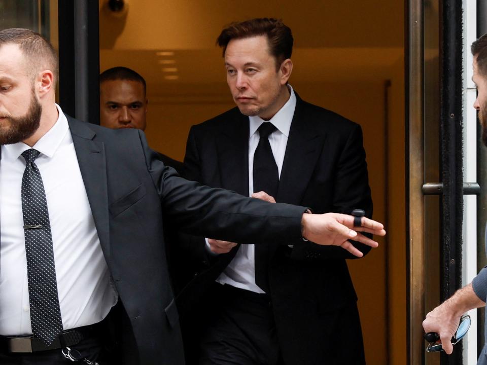 Elon Musk leaves Tesla's Washington office on January 27.