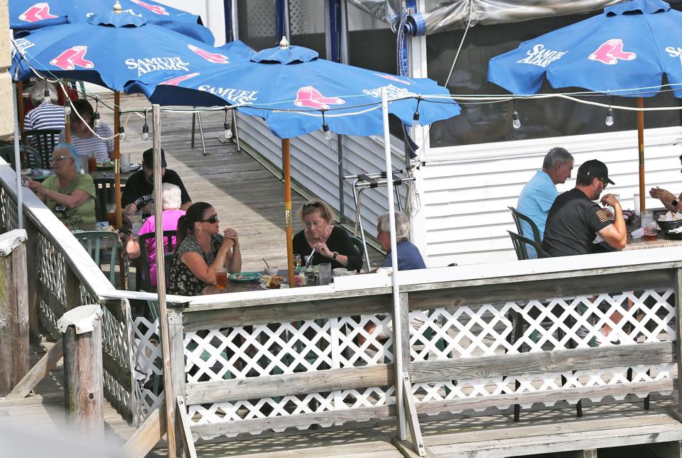 Diners are served on the outside deck during lunchtime on Aug 11, 2023 at Warren's Lobster House in Kittery.