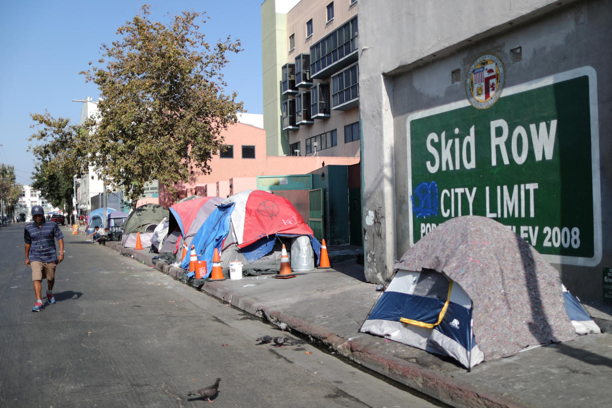 A man walks along Skid Row in Los Angeles on Oct. 14, 2019. (Photo: Lucy Nicholson / Reuters)