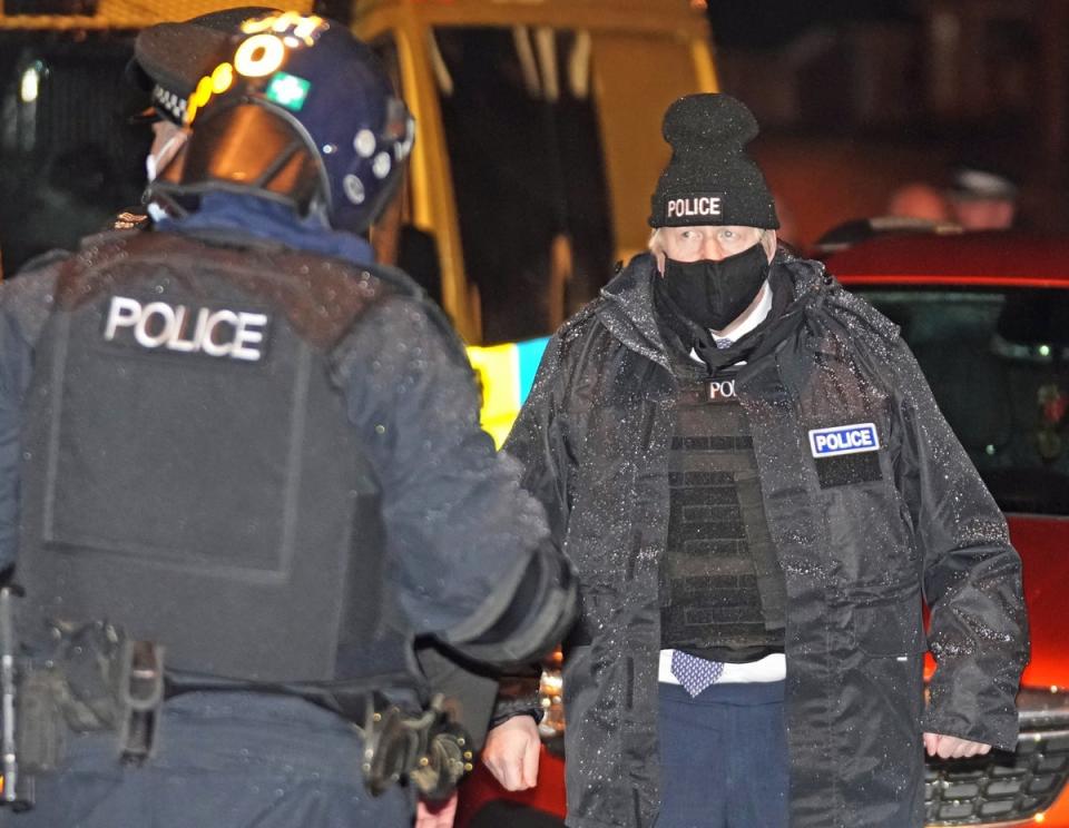 Prime Minister Boris Johnson observes an early-morning Merseyside Police raid on a home in Liverpool as the Government launched ‘crime week’ (Christopher Furlong/PA) (PA Wire)