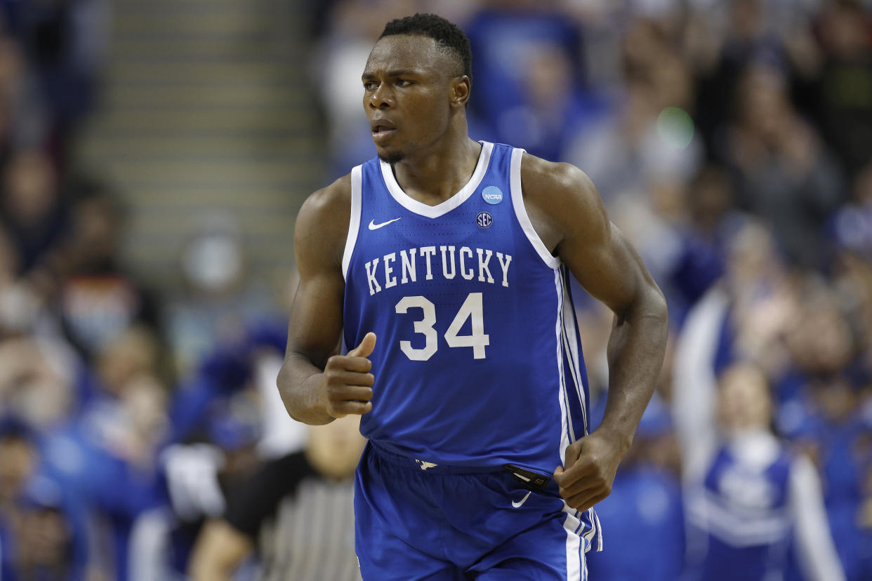 GREENSBORO, NORTH CAROLINA - MARCH 19: Oscar Tshiebwe #34 of the Kentucky Wildcats reacts during the second half against the Kansas State Wildcats in the second round of the NCAA Men's Basketball Tournament at The Fieldhouse at Greensboro Coliseum on March 19, 2023 in Greensboro, North Carolina. (Photo by Jared C. Tilton/Getty Images)