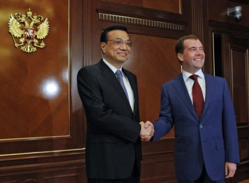 Russia President Dmitry Medvedev (right) shakes hands with visiting Chinese Vice Premier Li Keqiang during a meeting in the Gorki residence outside Moscow. Li, China's likely next premier praised a new Russia as he flew to Moscow for meetings with its leaders amid power transition in both countries