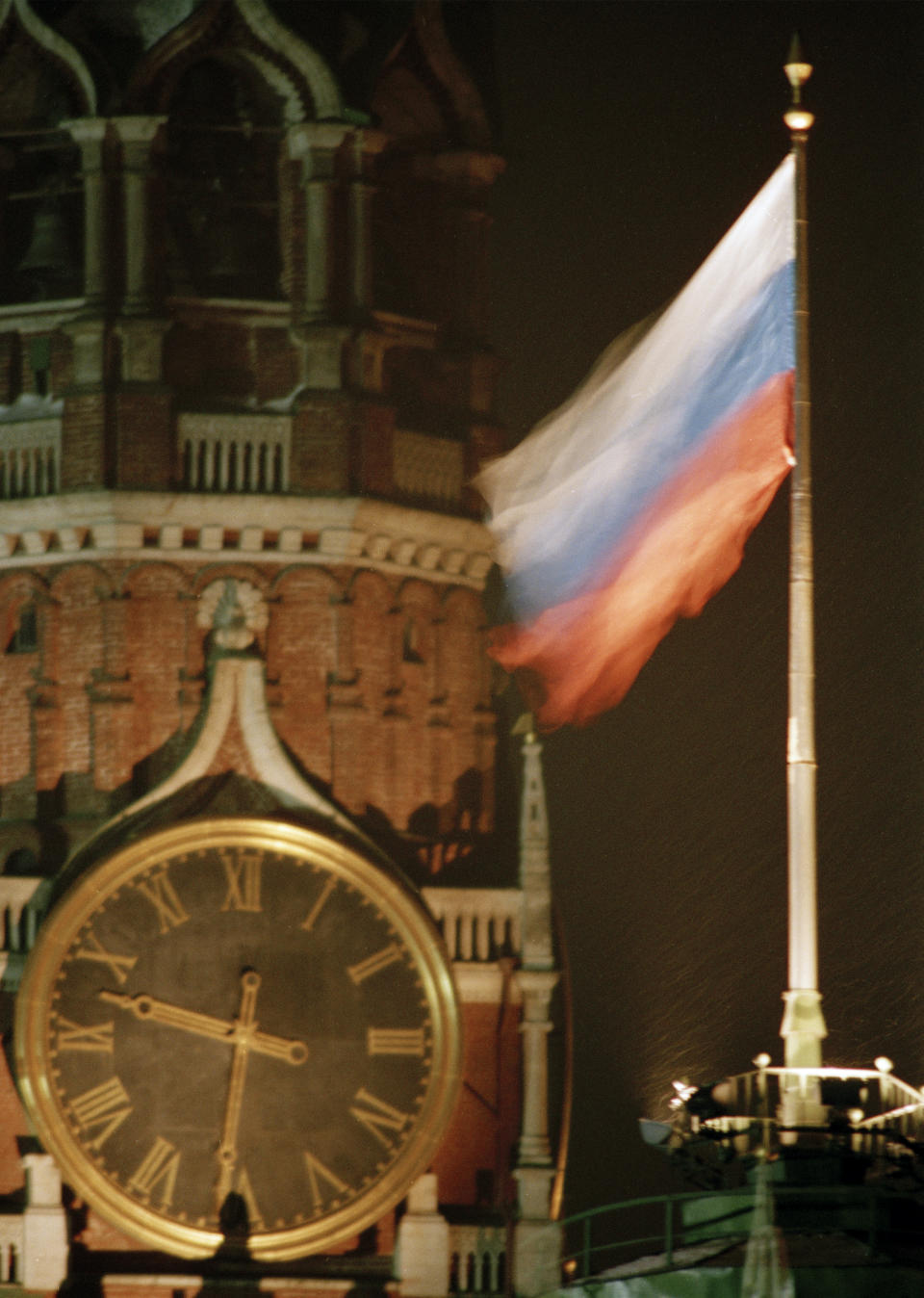 FILE - The newly-raised Russian flag flutters in the wind over the Kremlin in Moscow in place of the Soviet flag which was removed immediately after the resignation of Soviet Mikhail Gorbachev, on Wednesday, Dec. 25, 1991. After Soviet President Mikhail Gorbachev stepped down on Dec. 25, 1991, people strolling across Moscow's snowy Red Square on the evening of Dec. 25 were surprised to witness one of the 20th century’s most pivotal moments — the Soviet red flag over the Kremlin pulled down and replaced with the Russian Federation's tricolor. (AP Photo/Alexander Zemlianichenko, File)