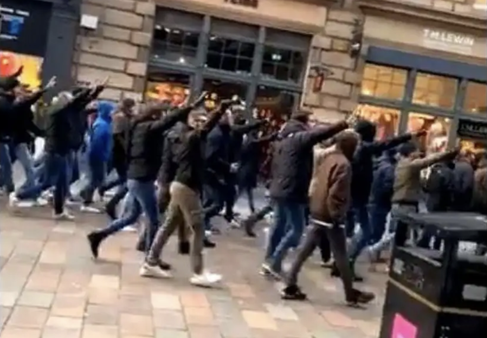 Lazio fans make Roman salute as they march in Glasgow ahead of their side's Europa League match against Celtic. 