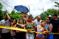 <p>People look on near of the wreckage of a Boeing 737 plane that crashed in the agricultural area in Boyeros, around 20 km (12 miles) south of Havana, on Friday shortly after taking off from Havana’s main airport in Cuba, May 18, 2018. (Photo: Alexandre Meneghini/Reuters) </p>