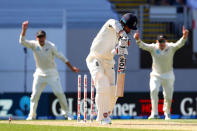 Cricket - Test Match - New Zealand v England - Eden Park, Auckland, New Zealand, March 22, 2018. New Zealand players celebrate as England's Moeen Ali is bowled during the first day of the first cricket test match. REUTERS/David Gray