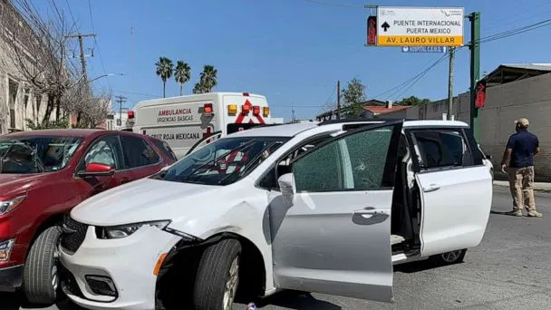 PHOTO: A member of the Mexican security forces stands next to a white minivan with North Carolina plates and several bullet holes, at the crime scene where gunmen kidnapped four U.S. citizens who crossed into Mexico from Texas, March 3, 2023. (AP)