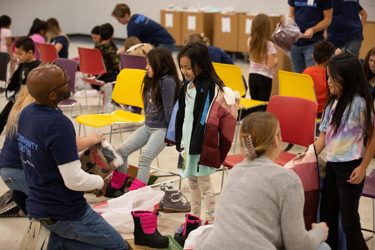 The West Des Moines-based Athene USA donated coats and boots to every student at four Des Moines Public Schools earlier this month. McKinley Elementary School students were among those who received free winter clothes.