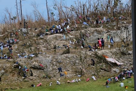 Displaced Haitian nationals take refuge on the grounds of the Government complex in the aftermath of Hurricane Dorian in Marsh Harbour