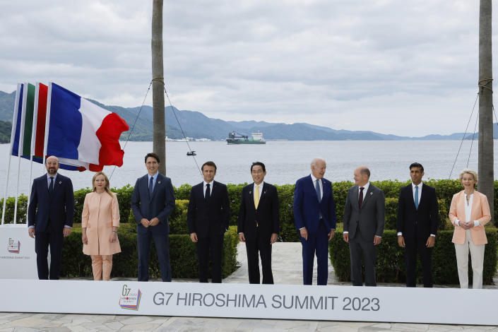 From left, President of the European Council Charles Michel, Italy's Prime Minister Giorgia Meloni, Canada's Prime Minister Justin Trudeau, France's President Emmanuel Macron, Japan's Prime Minister Fumio Kishida, U.S. President Joe Biden, Germany's Chancellor Olaf Scholz, Britain's Prime Minister Rishi Sunak and European Commission President Ursula von der Leyen participate in a family photo with G7 leaders before their working lunch meeting on economic security during the G7 summit, at the Grand Prince Hotel in Hiroshima, western Japan Saturday, May 20, 2023. (Jonathan Ernst/Pool Photo via AP)