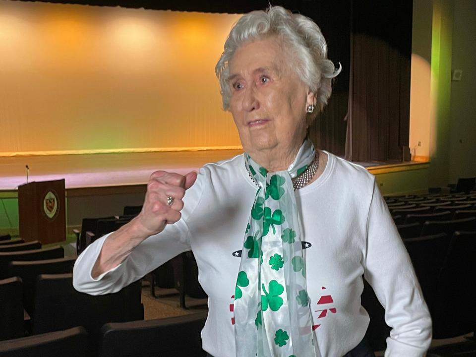 Helen Mabry Connor graciously agrees to give a “Go Irish” cheer on camera to be replayed at sporting events. She shines in the new St. Gregory the Great Auditorium at Knoxville Catholic High School on Tuesday, Aug. 9, 2022.