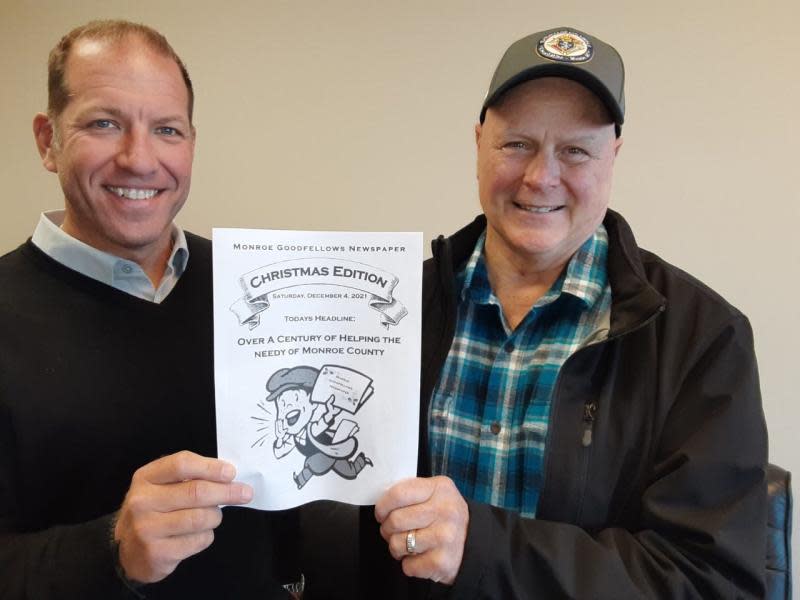 Matthew Hehl (left) and Jay Jondro hold a copy of the Goodfellow Paper that will be sold for any amount during the annual Monroe Goodfellow Sale that will be held Friday and Saturday.