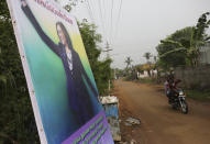 A banner featuring U.S. Vice President-elect Kamala Harris with a message wishing her the best is displayed in Thulasendrapuram, the hometown of Harris' maternal grandfather, south of Chennai, Tamil Nadu state, India, Wednesday, Jan. 20, 2021. The inauguration of President-elect Joe Biden and Vice President-elect Kamala Harris is scheduled be held today. (AP Photo/Aijaz Rahi)