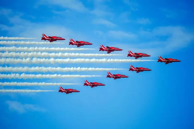 The RAF Red Arrows display team perform during the annual Southport Air Show at Southport beach in Merseyside