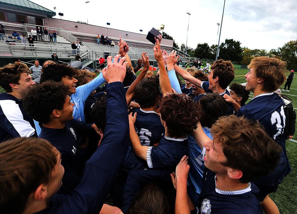 The Pingry boys soccer team celebrates after defeating Bernards to win the Somerset County Tournament title on Oct. 21, 2023