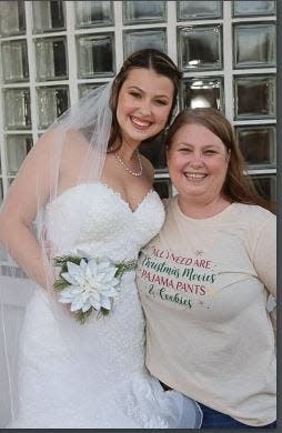 Julie Hall, with her daughter Ashley, who was trying on a wedding dress, was a special education teacher's aide in the Hutto school district.