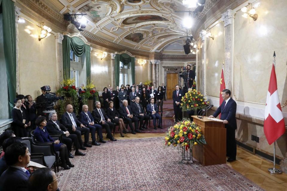 China's President Xi Jinping, right, speaks in the house of parliament during his two days state visit to Switzerland, in Bern, Switzerland, on Sunday, Jan. 15, 2017. ( Peter Klaunzer/Pool Photo via AP)