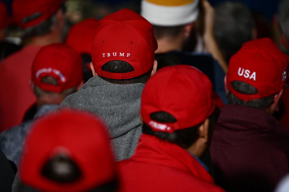 Supporters of former US President and 2024 presidential hopeful Donald Trump listen as he speaks at a Commit to Caucus Rally in Las Vegas, Nevada, on Jan. 27, 2024.
