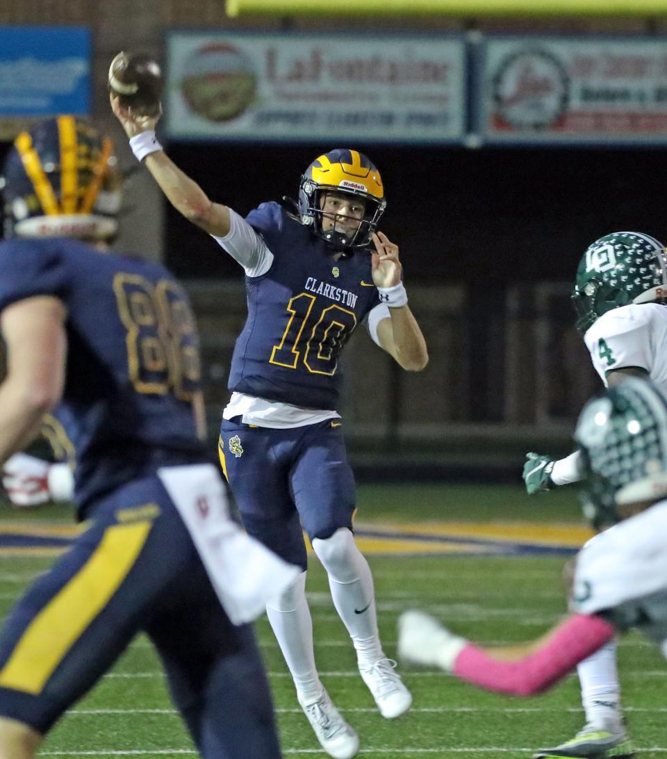Clarkston quarterback Brady Collins passes against Lake Orion during first-half action at Clarkston High School on Friday, Oct. 6, 2023.