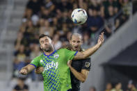 Los Angeles FC defender Giorgio Chiellini, right, and Seattle Sounders forward Will Bruin try to head the ball during the first half of an MLS soccer match Friday, July 29, 2022, in Los Angeles. (AP Photo/Ringo H.W. Chiu)