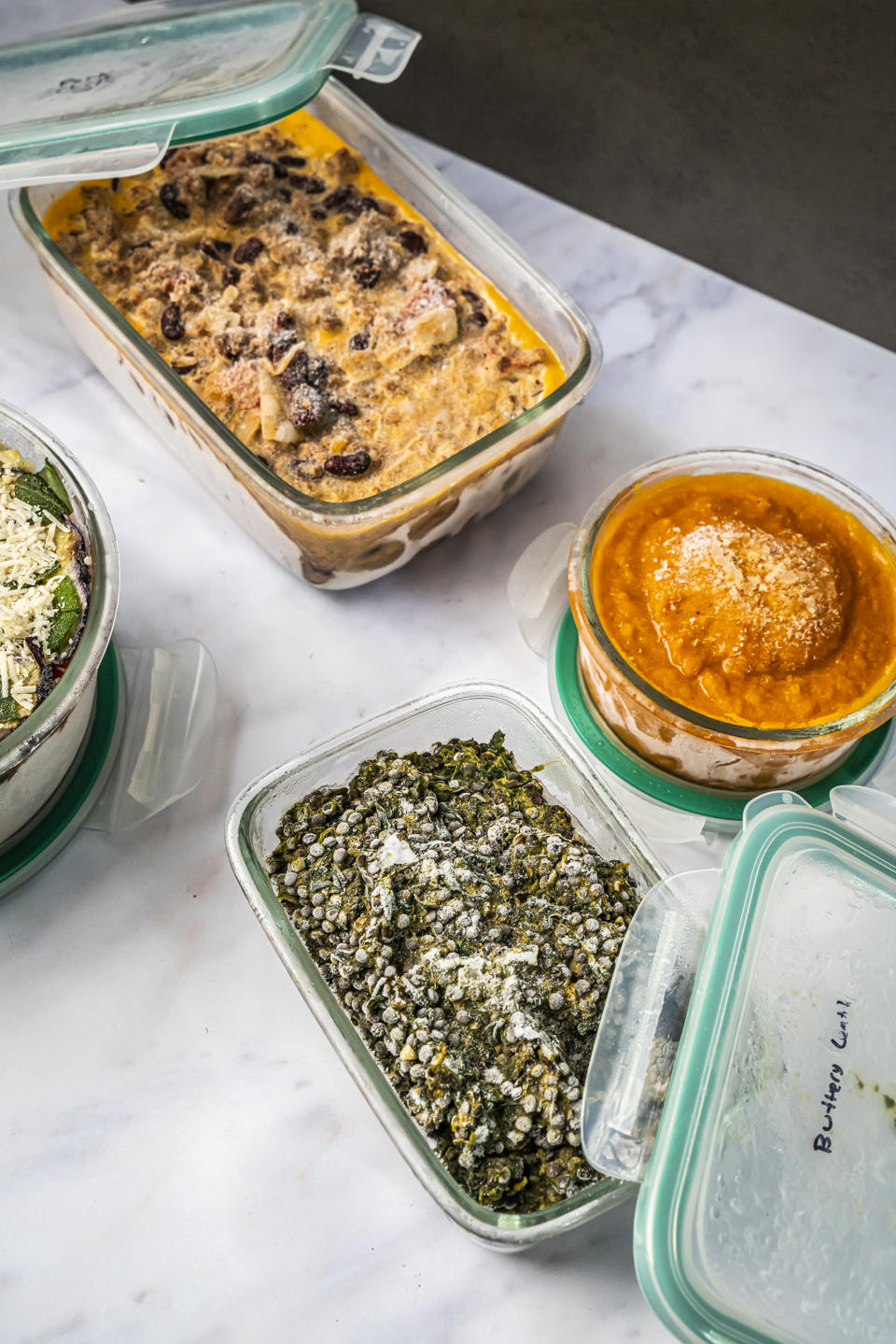 Some one-pot freezer meals: pork chili, carrot ginger soup, buttery lentils with spinach and eggplant Parmesan. (Noah Fecks)