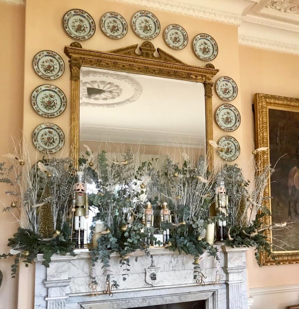 Silver branches, Nutcrackers, and glittered birds adorn our fireplace in the drawing room.