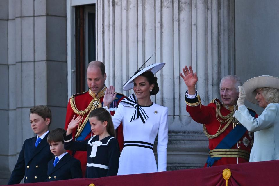 Members of the Royal Family wave to crowds from the balcony (AFP via Getty Images)