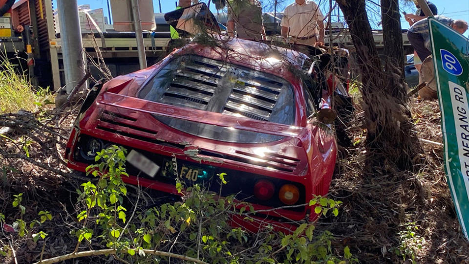 Pictured the back of the Ferrari hanging in the ditch. Source: Facebook