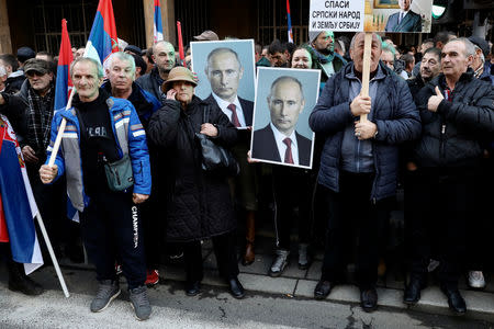 People watch a march during the visit of Russian President Vladimir Putin in Belgrade, Serbia, January 17, 2019. REUTERS/Kevin Coombs