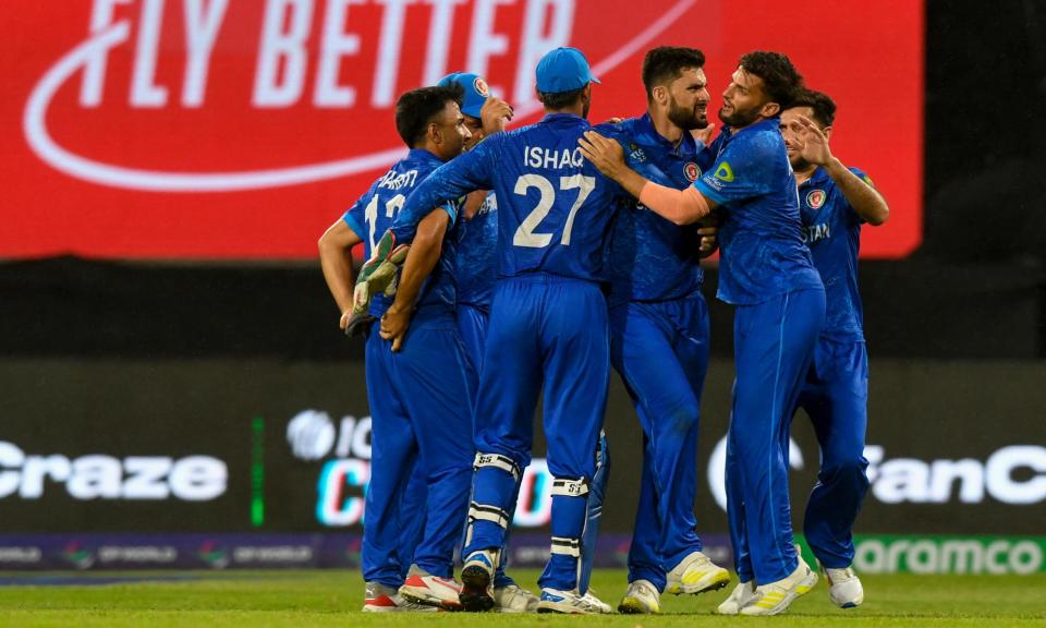 <span>Afghanistan beat Bangladesh to reach the T20 World Cup semi-finals at the expense of Australia.</span><span>Photograph: Randy Brooks/AFP/Getty Images</span>