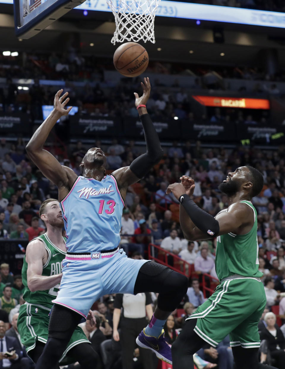 Miami Heat forward Bam Adebayo (13) goes to the basket as Boston Celtics forward Gordon Hayward, left, and guard Jaylen Brown defend during the first half of an NBA basketball game, Tuesday, Jan. 28, 2020, in Miami. (AP Photo/Lynne Sladky)