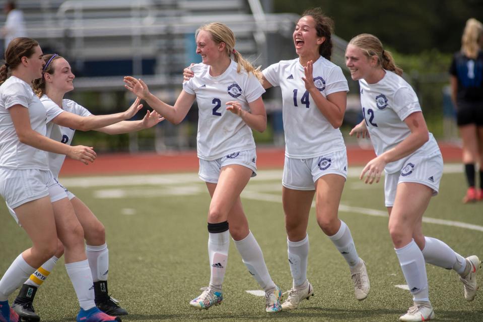 Lakeview varsity soccer players celebrate a point at Harper Creek High School on Saturday, May 14, 2022.