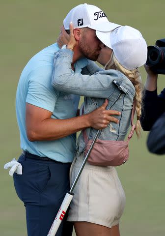 <p>Ezra Shaw/Getty</p> Wyndham Clark and Alicia Bogdanski after his winning putt on the 18th green during the final round of the 123rd U.S. Open Championship on June 18, 2023 in Los Angeles, California.