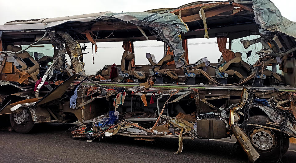 The remains of a Kerala state-run bus that collided head-on with a truck near Avanashi, Tamil Nadu state, India, Thursday, Feb.20, 2020. At least 19 people were killed and more than 20 were injured in the accident. (AP Photo)