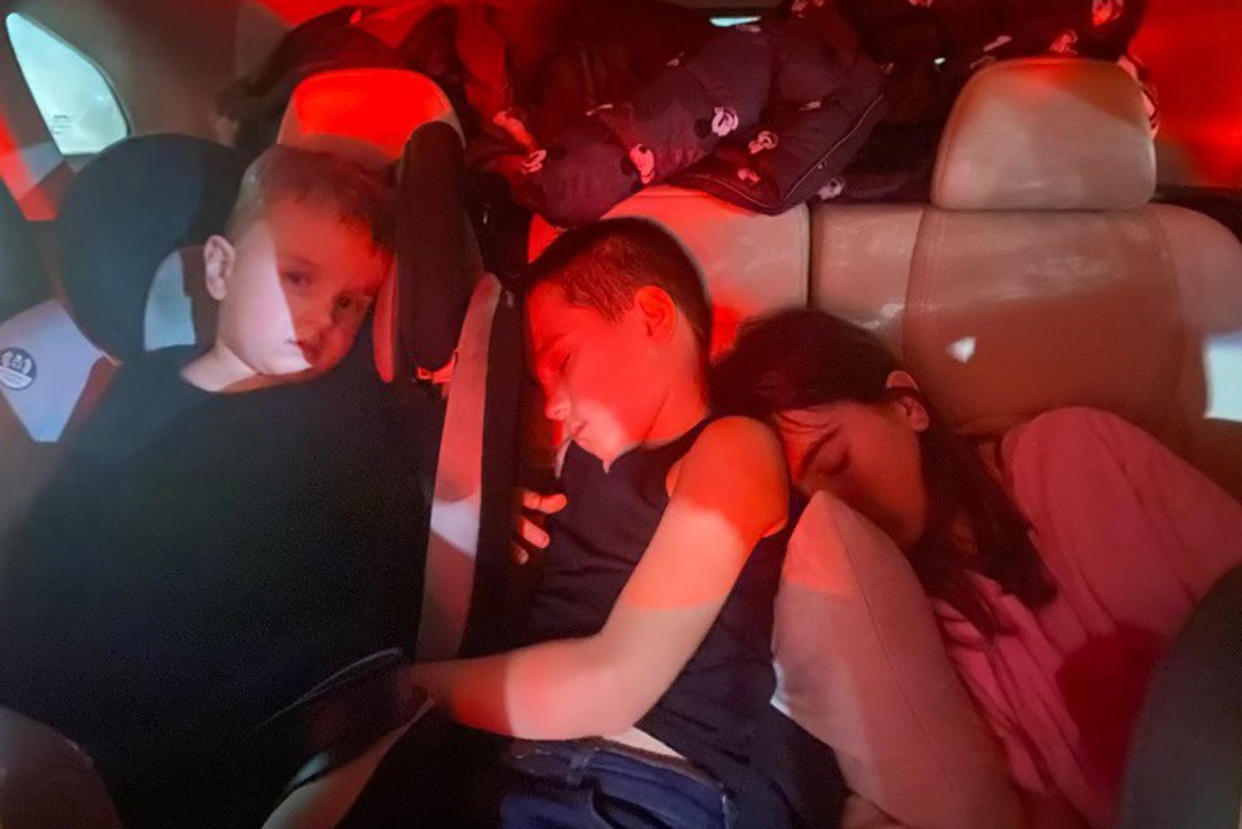 Ukrainian refugees Danylo, age 3, Lev, 7, and Vasilisa Halytska, 11, slept in the car for several days, as their family tried to make their way out of Ukraine. (Masha Halytska)