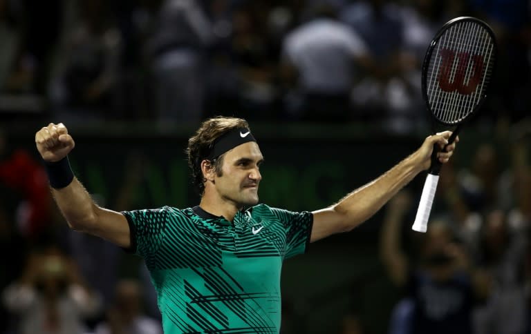 Roger Federer of Switzerland celebrates defeating Nick Kyrgios of Australia in the semi-finals at the Miami Open