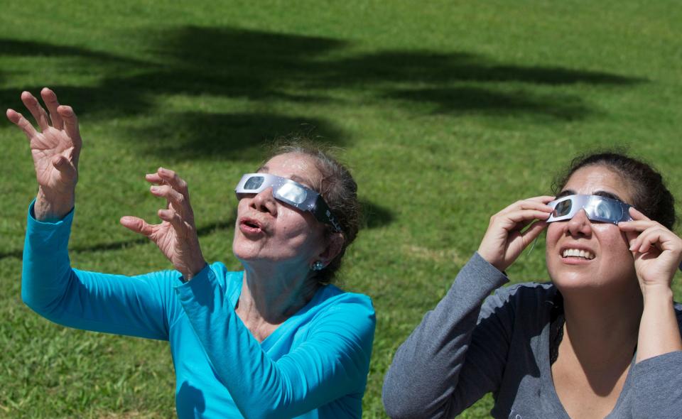 Even with cloudy skies in the forecast, experts urge those viewing Monday's eclipse to use proper safety eyewear when looking toward the sky.