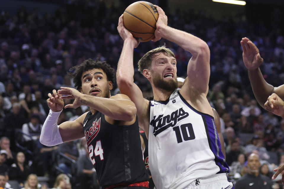 Sacramento Kings forward Domantas Sabonis (10) shoots against Portland Trail Blazers forward Justin Minaya (24) during the second half of an NBA basketball game in Sacramento, Calif, Wednesday, Nov. 8, 2023. (AP Photo/Jed Jacobsohn)